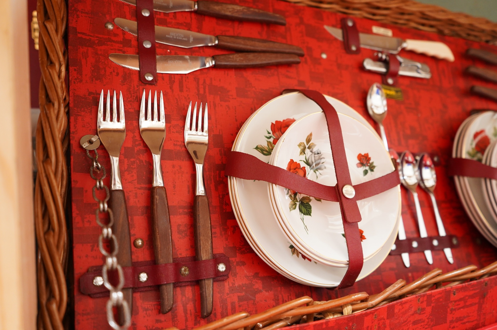 An Asprey wicker picnic basket, fully fitted with contents